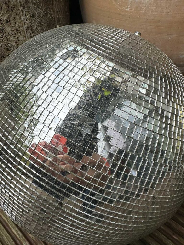Silver mirror ball after 3 years outdoors showing minimal weathering and intact tiles